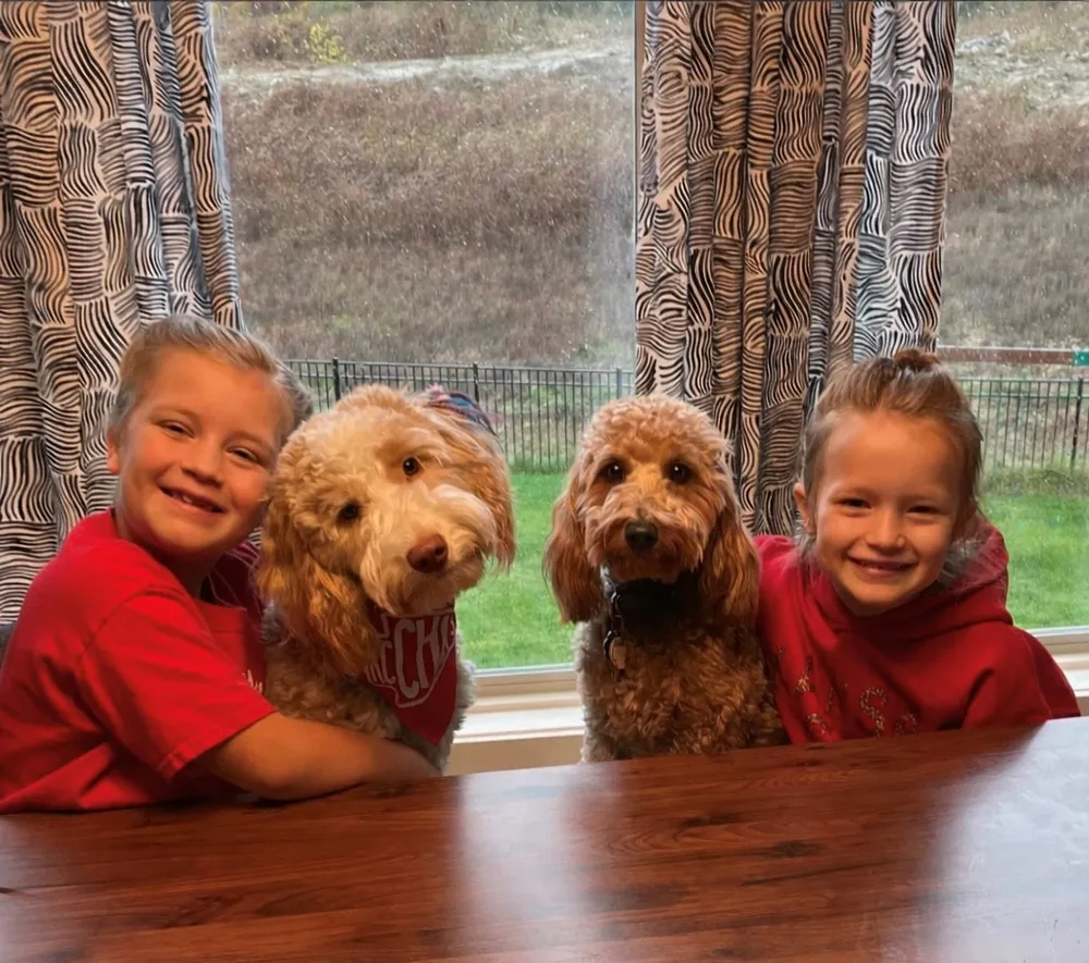 The Sola family with Hope, a Blessed Day Doodles guardian-home parent dog